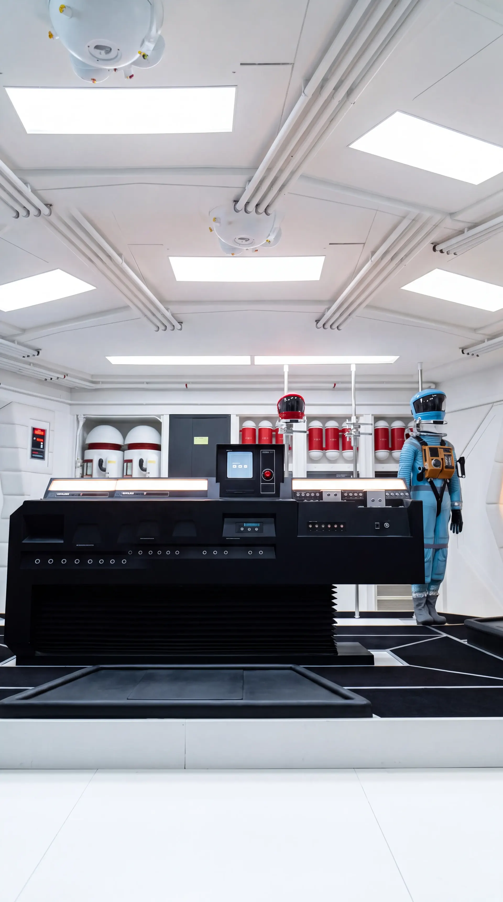 The Discovery flight deck, shot tall, red eye above the console.